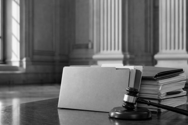 Immigration court case files and gavel representing administrative closure review