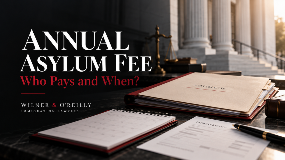 Asylum case folder, calendar, and payment receipt on a legal desk illustrating annual asylum fee deadlines