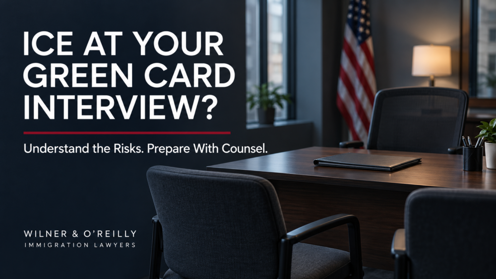 Empty immigration interview office with the headline ICE at Your Green Card Interview? and guidance to prepare with counsel.