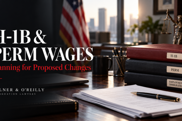 Salary planning documents and employment case folders on a desk illustrating proposed H-1B and PERM wage changes