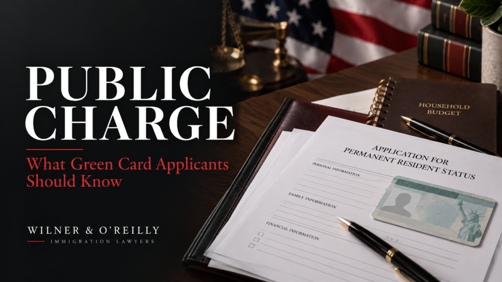 Green card application paperwork and household budget notebook illustrating public charge review and family finances